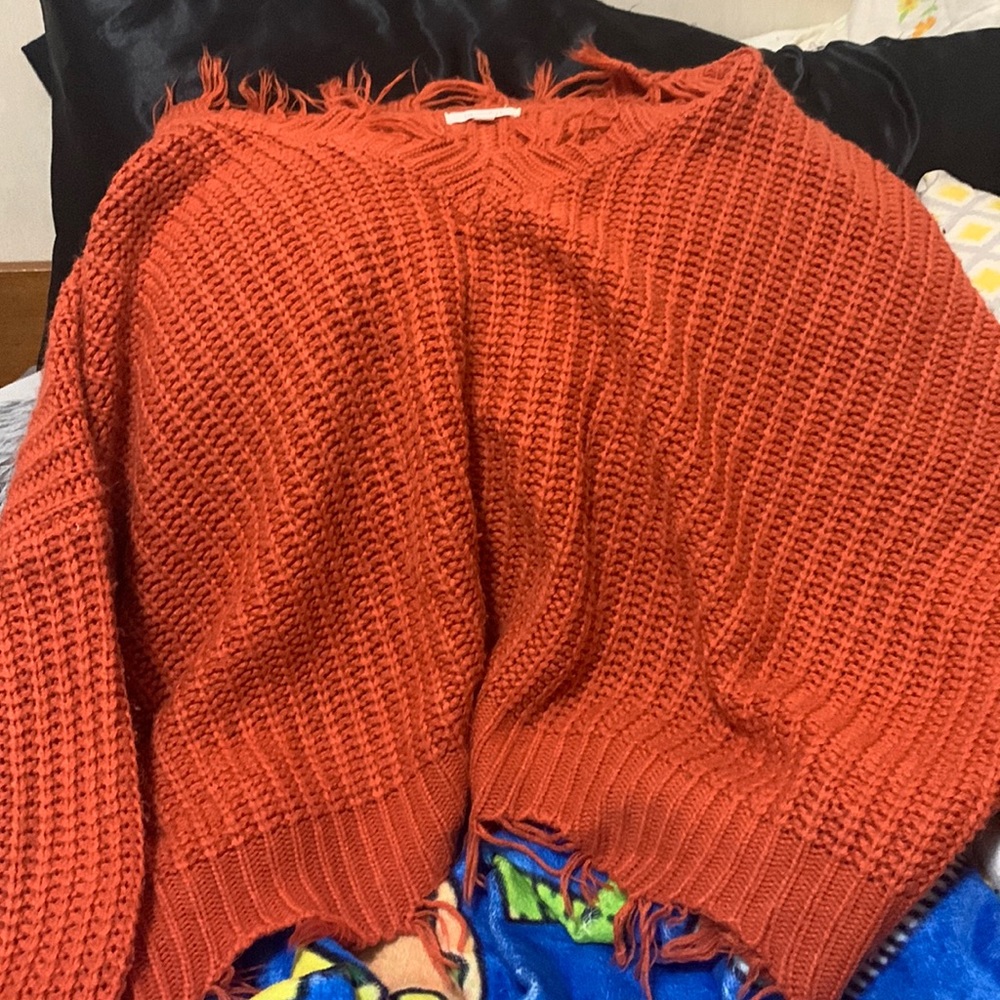 It’s an orange sweater large